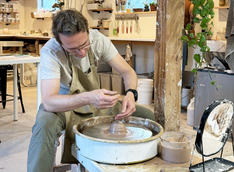 Daniel Branco at a potter's wheel